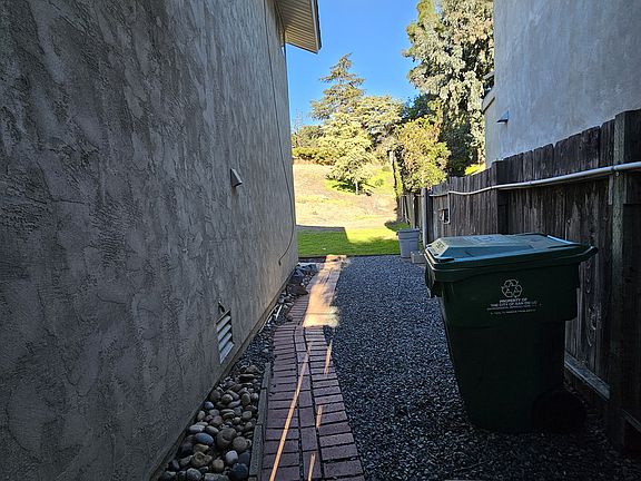 Right side of yard by 6 foot gate