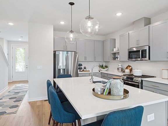 Kitchen with pendant lighting over island