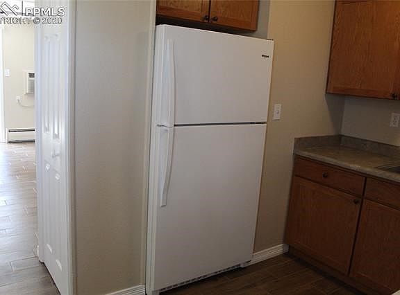 Brand new large refrigerator with glass shelving