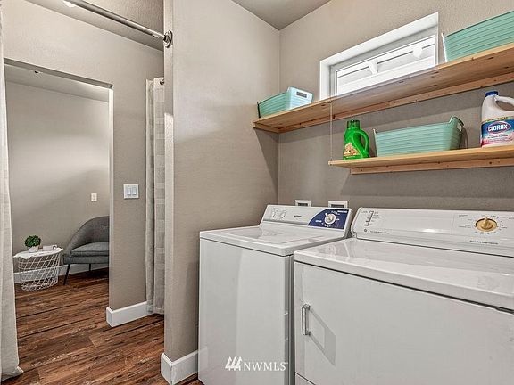 Laundry with view into small backroom