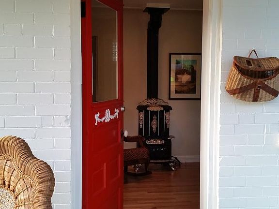 Front Door opens to living room and antique stove