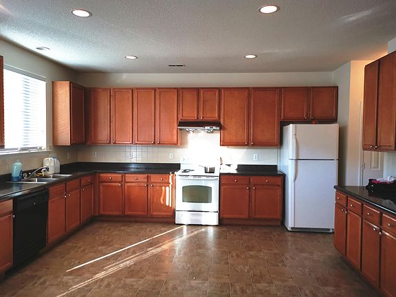 Kitchen with pretty of cabinet space and counter