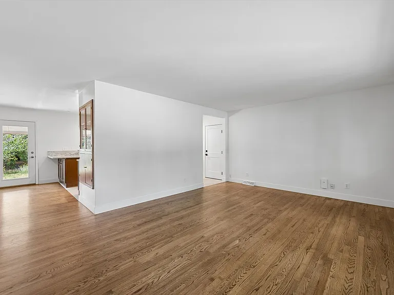 from front door into kitchen and door to 2 car attached garage