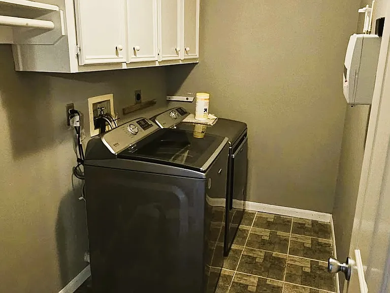 Laundry room has new washer and dryer that were used for 2 months only