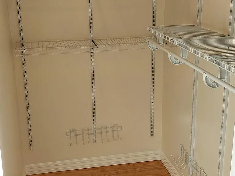 Secondary bedroom 6' walk-in closet with adjustable shelves
