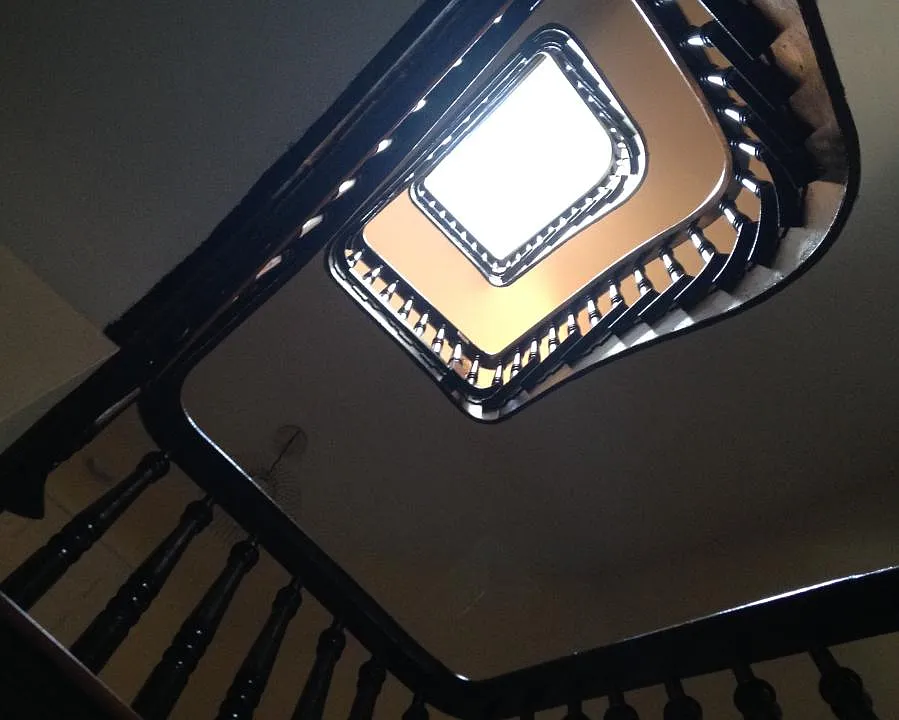 Stair hall in unit goes up four floors and ends in skylight