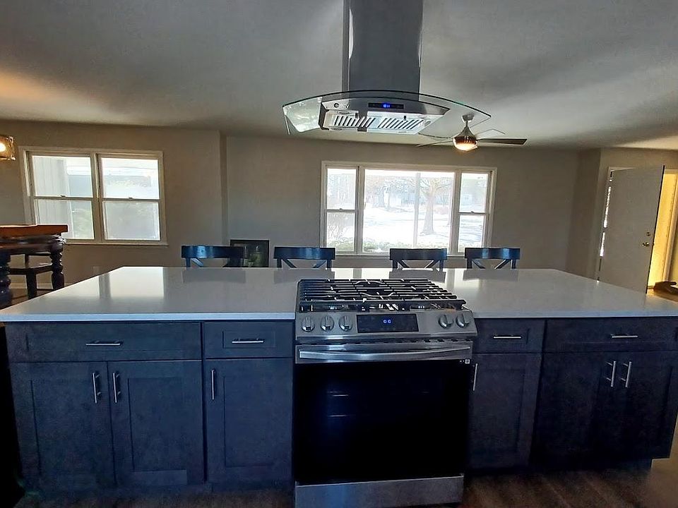 Open cook top and island eating space