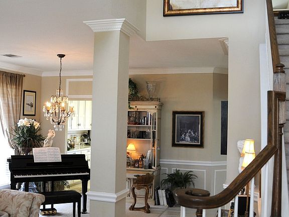Soaring Foyer w/ Sweeping Staircase