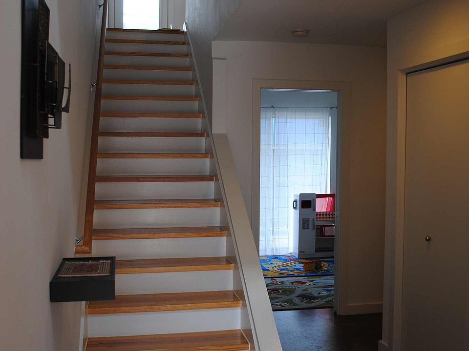 The first floor entry features polished cement floors.