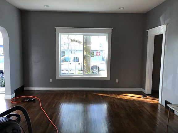 living room window and hardwood floors