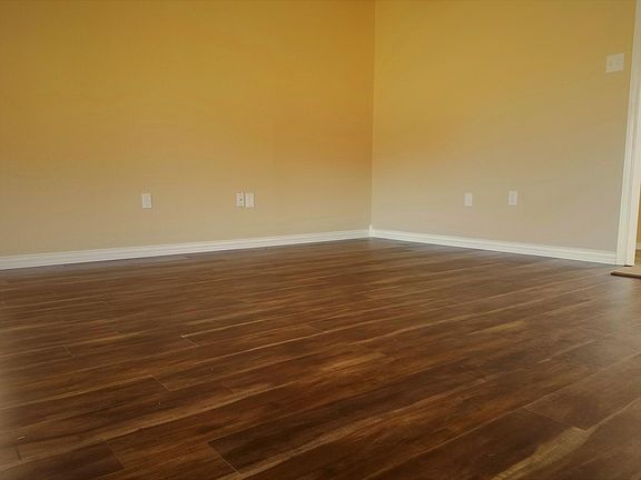 Laminate flooring in den.