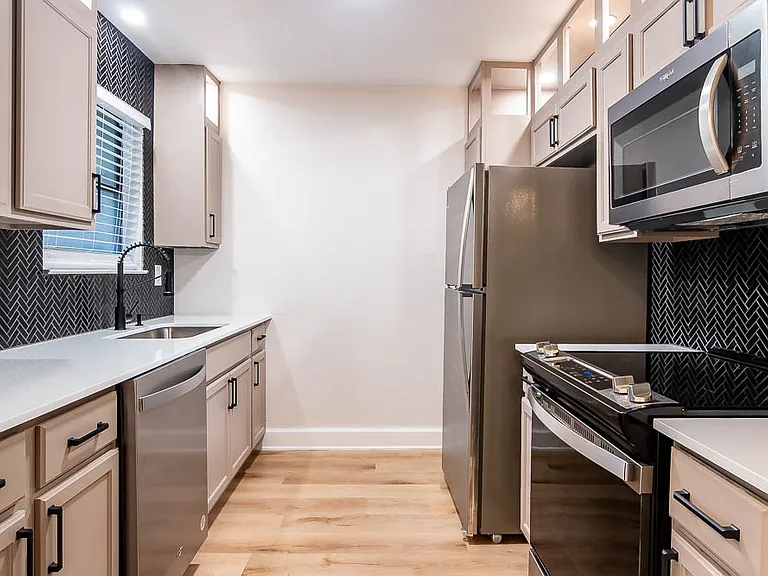 Most of our newly renovated kitchens include granite countertops and unique backsplashes!