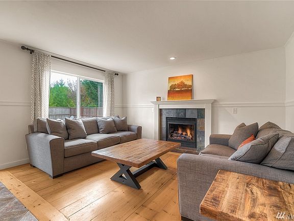 Cozy Family Room off kitchen with a cozy gas fireplace. 