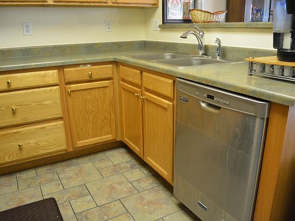 Kitchen with new stainless steel dishwasher