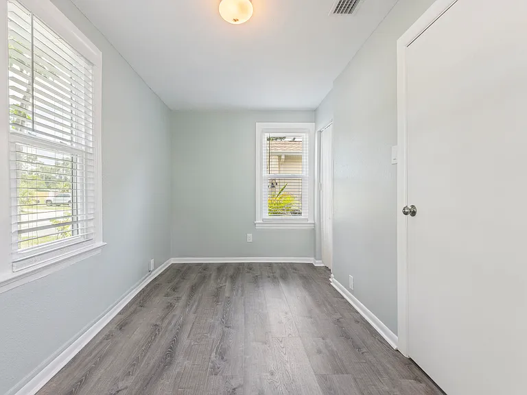 Filled with natural light from multiple windows, this versatile second bedroom offers a warm, inviting space_perfect as a guest room, office, or cozy retreat.