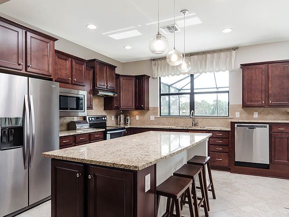 Model Representation Gourmet kitchen with large center island