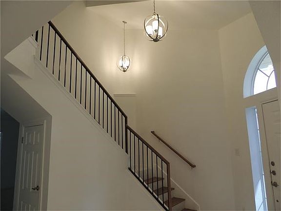View of front stairway leading to the upstairs bedrooms and