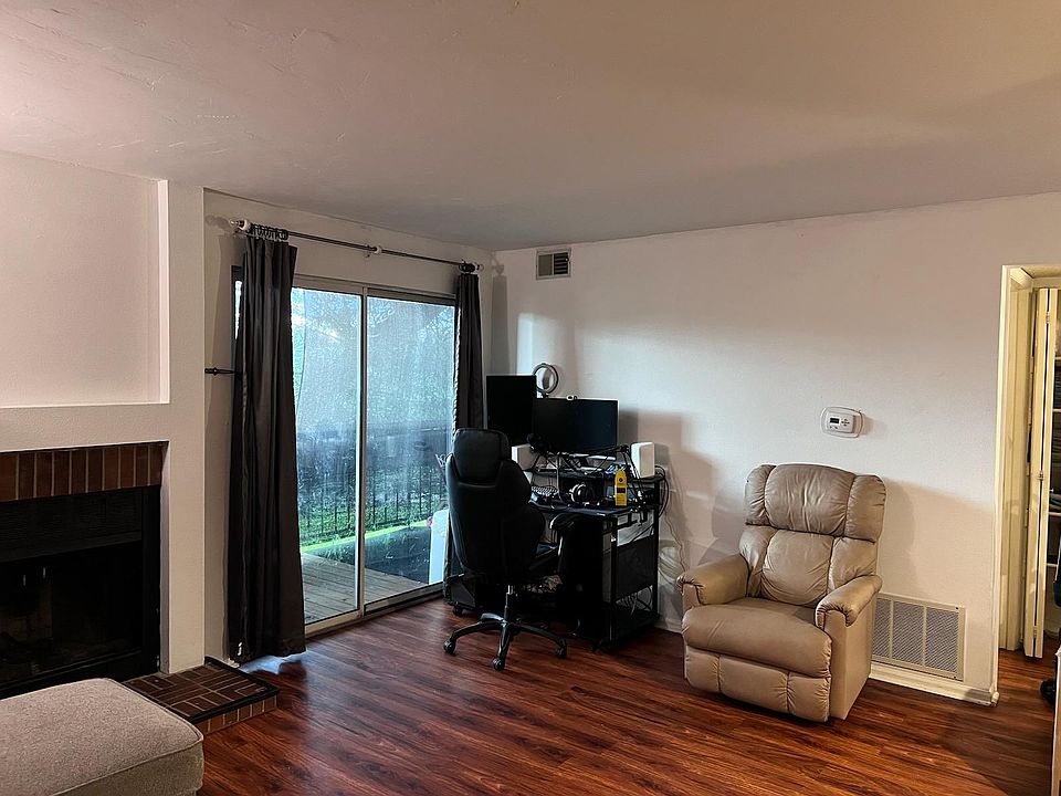 Living room with access to patio overlooking large park