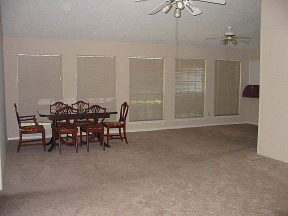 One wall is flanked with windows for natural light and a cheery atmosphere.