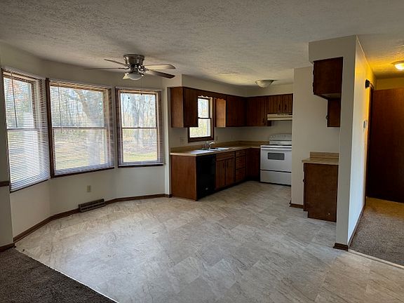Kitchen with brand new tile flooring. Refrigerator not pictured as a new one is being delivered.