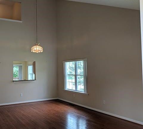 Living Room/Dining Room with lovely wood floors