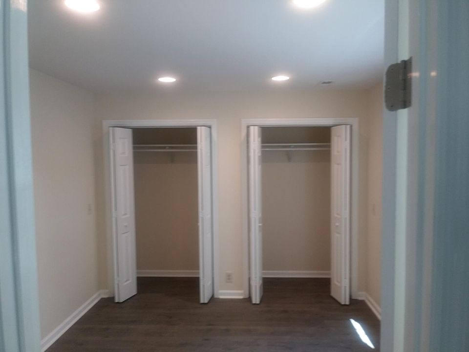 Double closets main bedroom suite with private bath with rain shower.