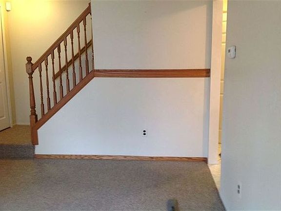 Living room, stairs to bedrooms and bathroom