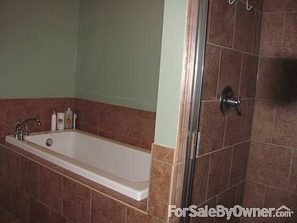 Master Bathroom Deep Soaking Tub : Master Bath has large soaking tub, separate tiled shower