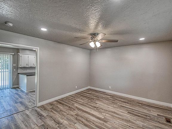 Living room with view of dining room and kitchen