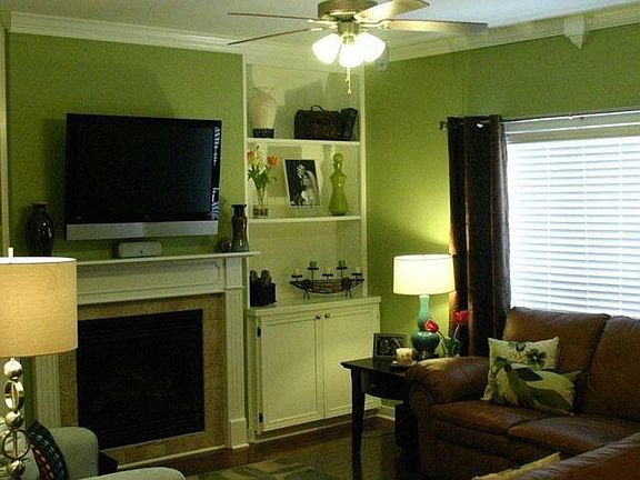 Living room. Large built in storage and media cabinet. Wires