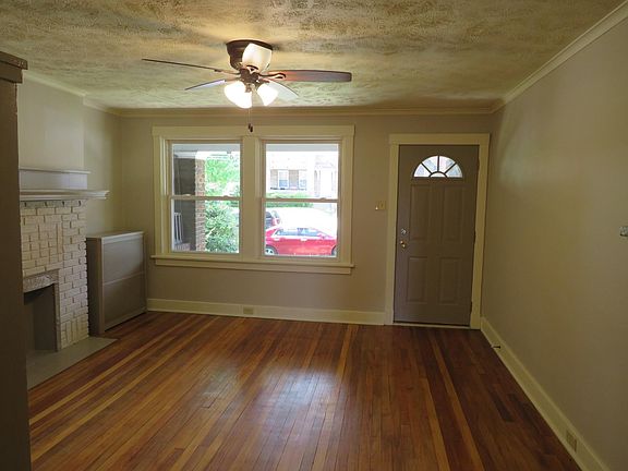 Light and bright living room welcomes you with hardwood flooring and fresh paint.