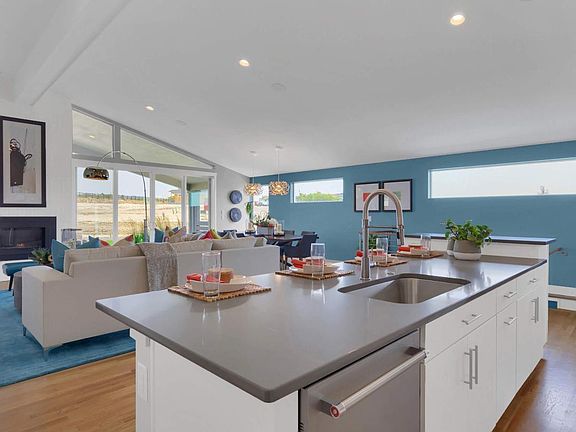 The kitchen overlooks the great room and casual dining for an open feel