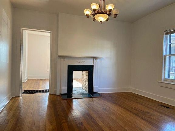 Dining room. Decorative fireplace connects to living room.