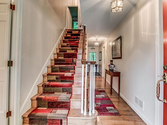 Gracious center hall foyer with hardwoods