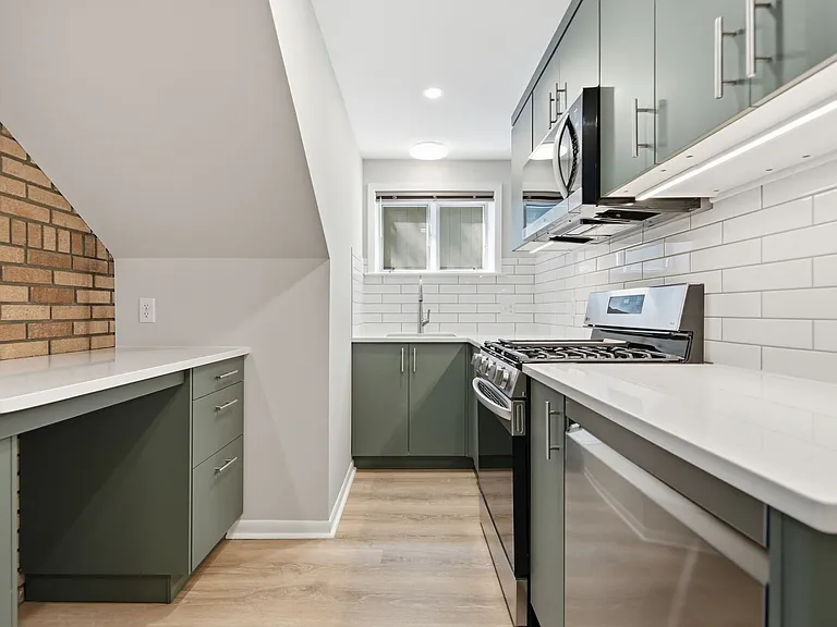 Brand-new kitchen with all the amenities and extensive cabinet storage, with south-facing window