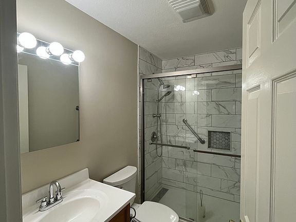 2nd floor bathroom with tile shower.