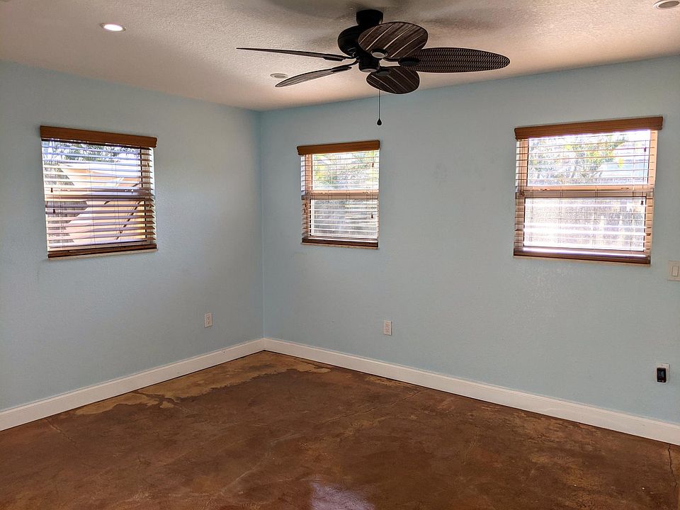 Open bonus room just off the kitchen_ideal for a dining area, playroom, home office, or second living space. Plenty of natural light, ceiling fan, and flexible layout to fit your lifestyle.