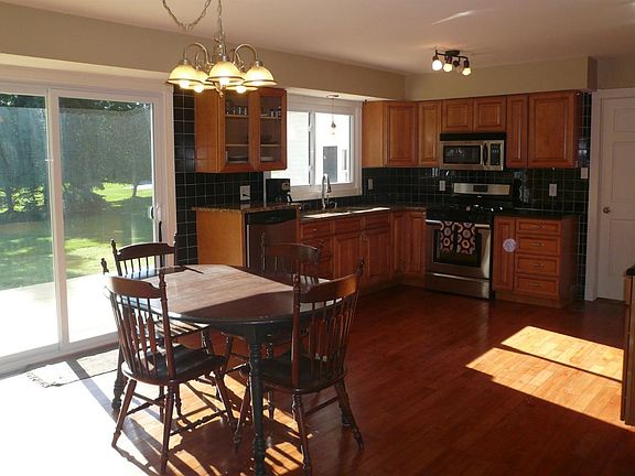 Open concept kitchen with eat-in breakfast area.