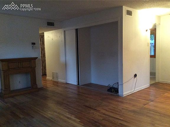 Living room looking to hallway.  Hardwood floors in all three bedrooms!