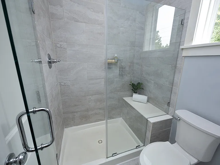 Frameless shower with bench in Primary bath