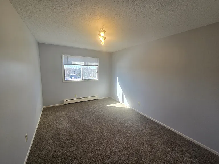 Bedroom one/master bedroom with new carpet.