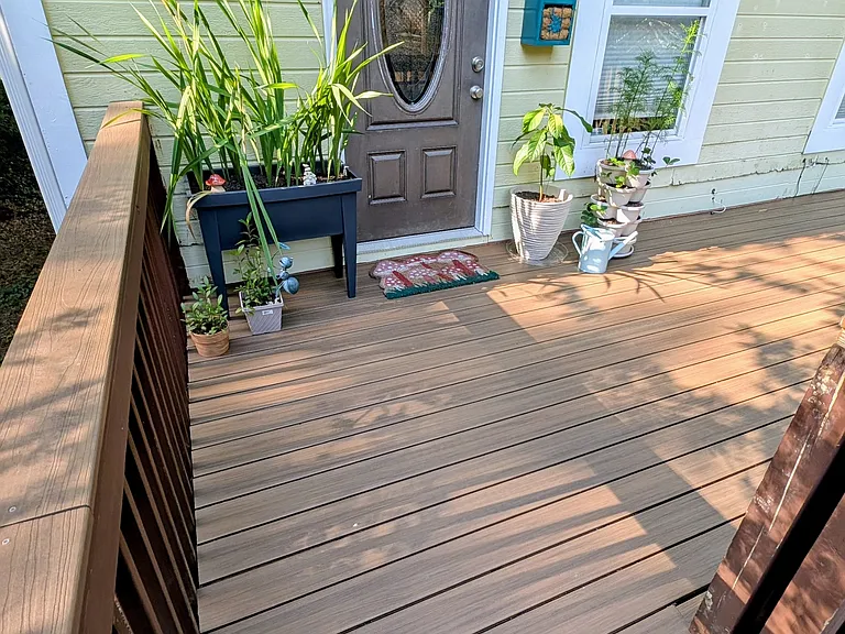 Front porch with easy to clean and splinter free enhanced composite decking boards.