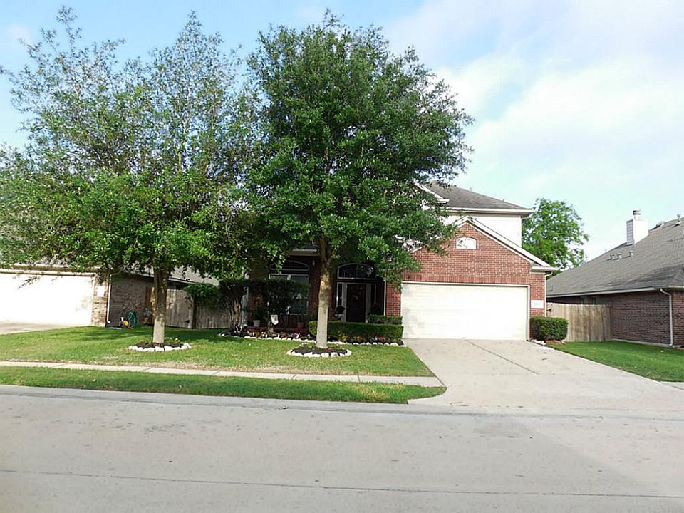 Great shade trees in this nicely landscaped front yard