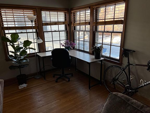 North and West facing windows just inside the unit door - new cordless wood blinds throughout