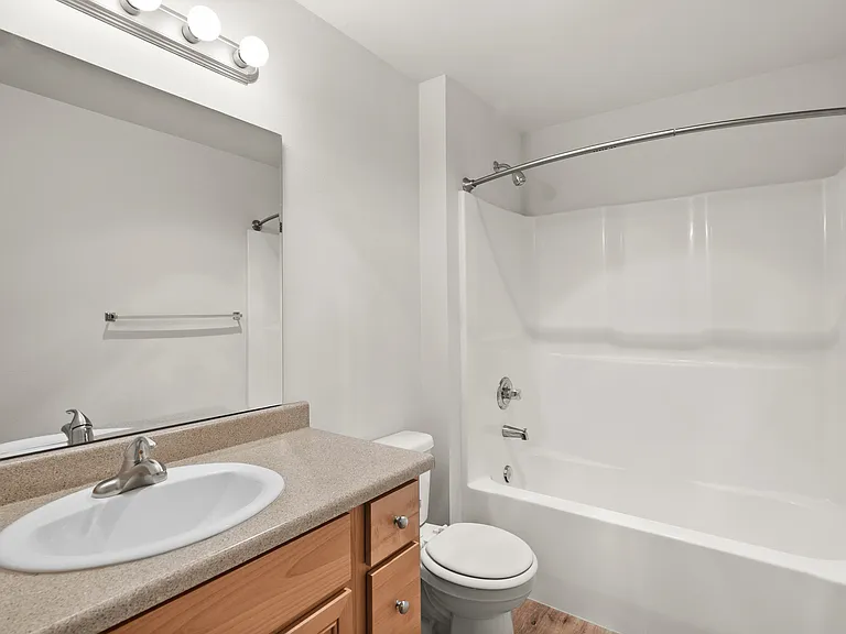 Elegant bathroom featuring a modern vanity, stylish lighting, and sleek bathtub for a tranquil retreat. Elegant bathroom featuring a modern vanity, stylish lighting, and sleek bathtub for a tranquil retreat.