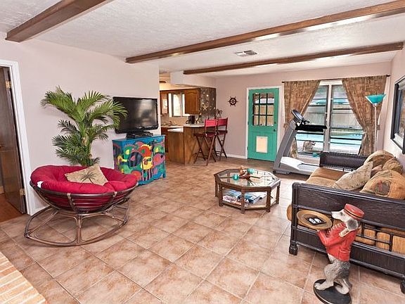 Open living room with beautiful wood beams
