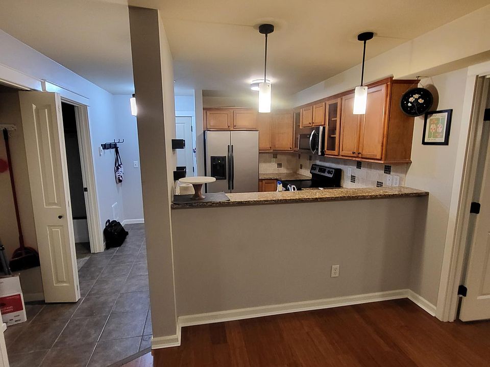 From LR looking into kitchen; front door is left of fridge