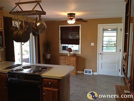 Dining area with door to screened in porch and slider to deck
