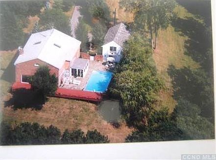 The view from above shows the house garage patio and pool. The pool is not currently open.
