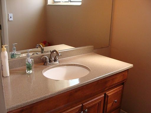 Remodeled baths w/ new tile and corian/wood cabinets